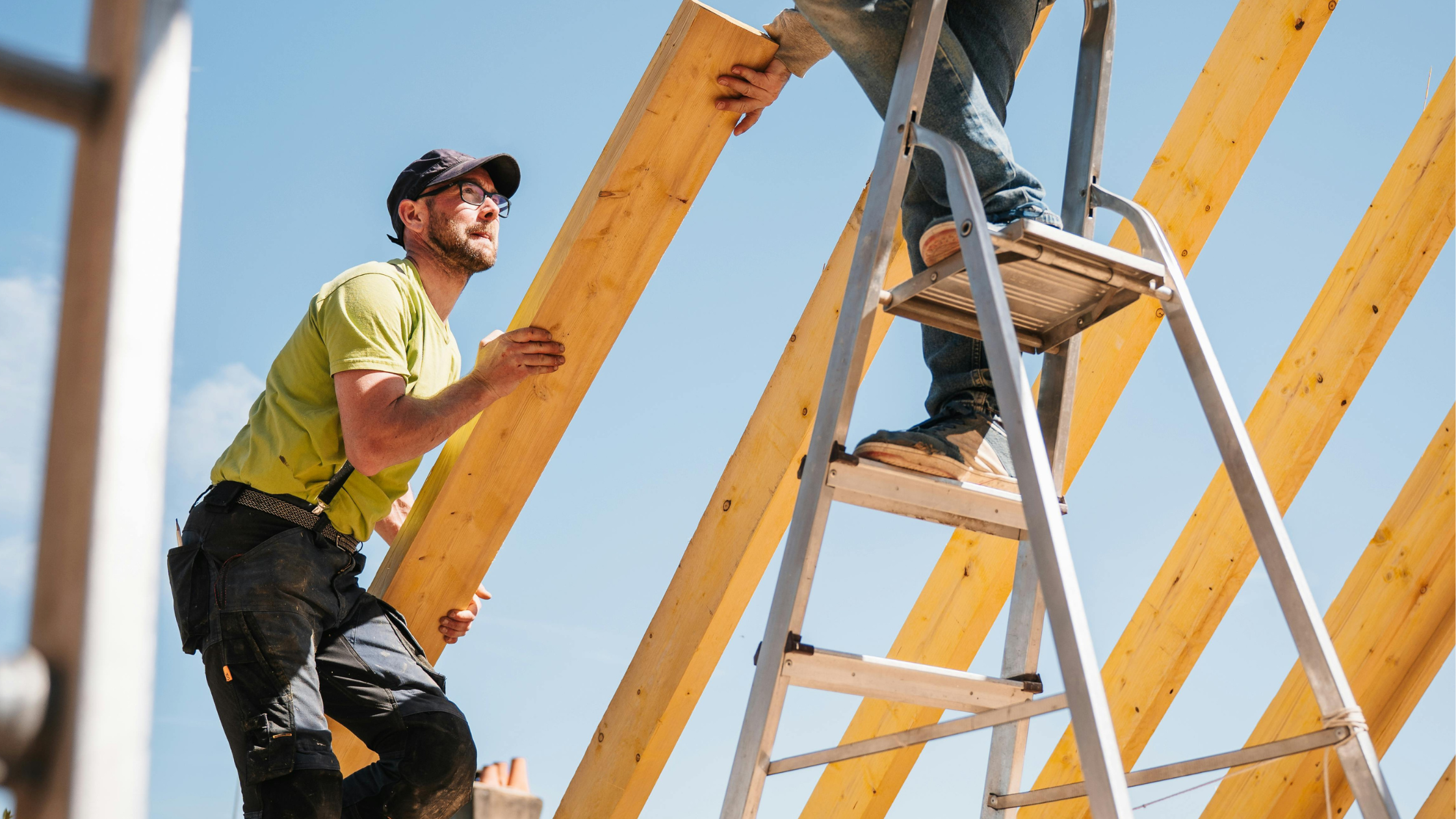 A group of men on ladders AI-generated content may be incorrect.